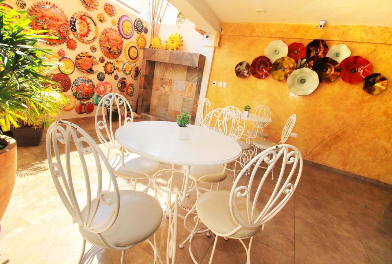 Papagayo Hotel Boutique Playa del Carmen Exterior photo A typical interior of a coffee shop in the city