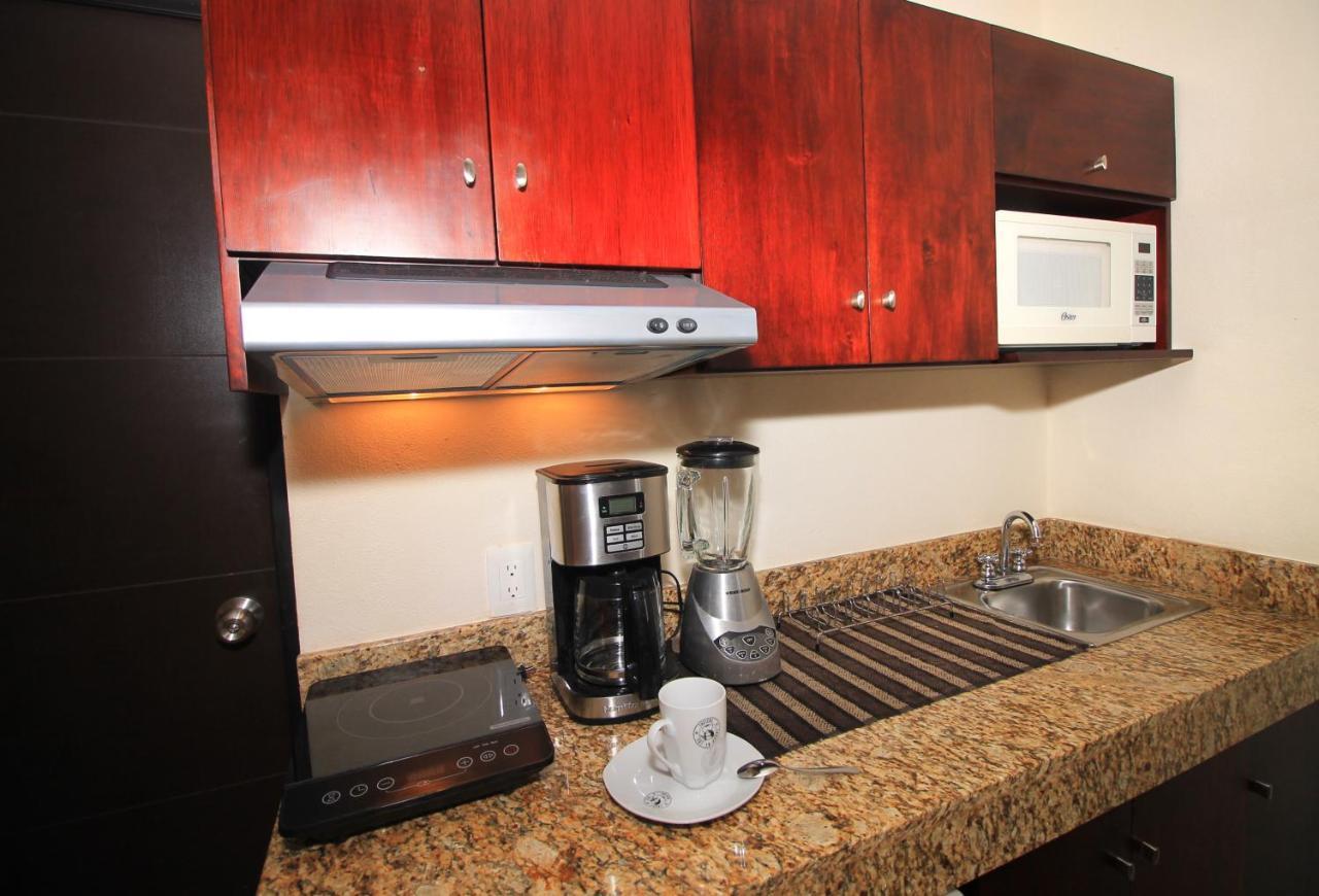 Papagayo Hotel Boutique Playa del Carmen Exterior photo A coffeemaker in a kitchen